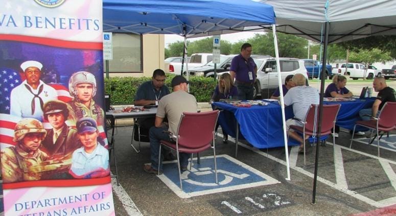 Waco RO employees conducting personal interviews with Veterans and their family members, from temporary outdoor booths, erected at the Waco RO.